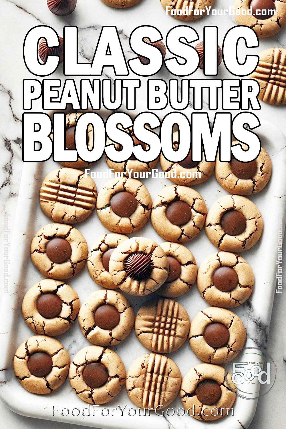 Classic Peanut Butter Blossoms arranged on a white marble background with visible cracks and chocolate candies in the center, showcasing their rustic and homemade charm.